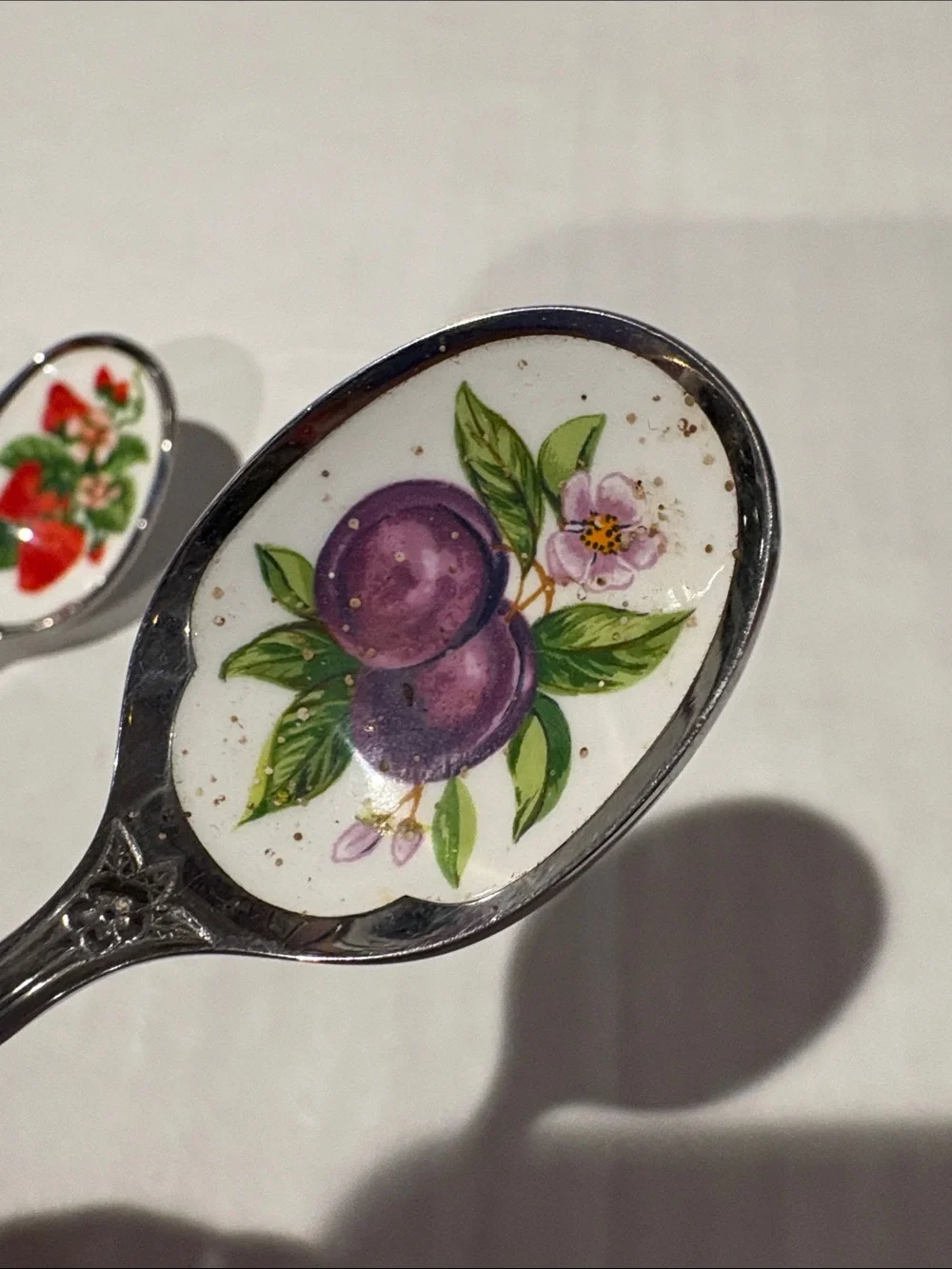 Avon collectors fruit spoons and hang rack